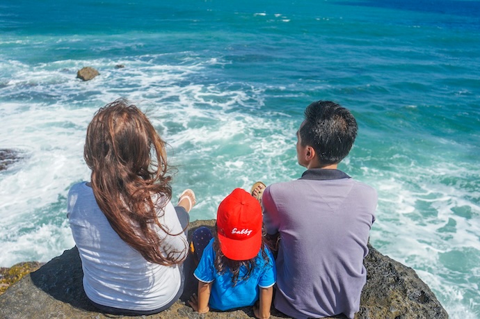 family looking at the sea