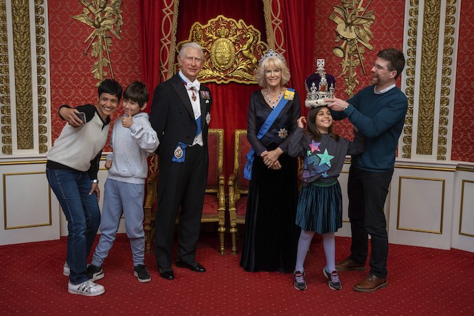 a family interact with the royals