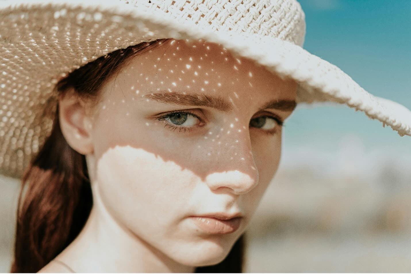 a girl wearing a sun hat