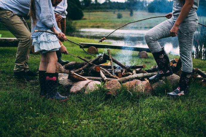 a family around a campfire