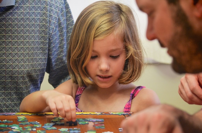 Family doing puzzle