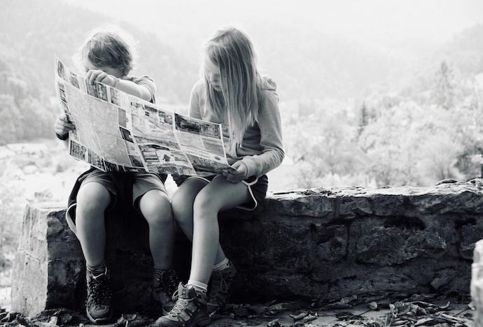 kids looking at map