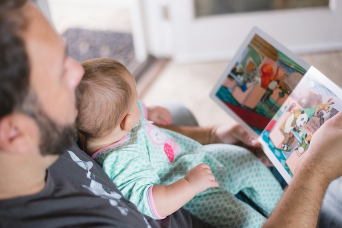 dad and baby reading