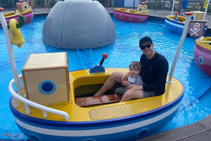 dad and son in boat ride